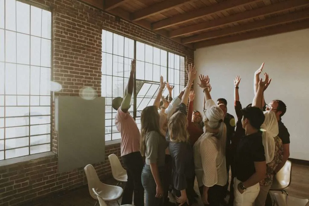 A group of coworkers gathering for a team meeting