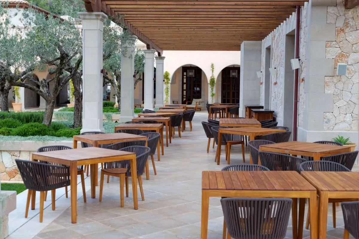 An outdoors patio dining area of a restaurant in New Orleans